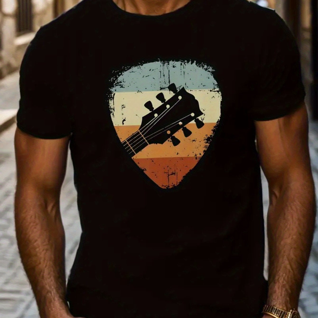 A black short-sleeved men's T-shirt with a printed graphic of a guitar in the center, featuring a round neckline.