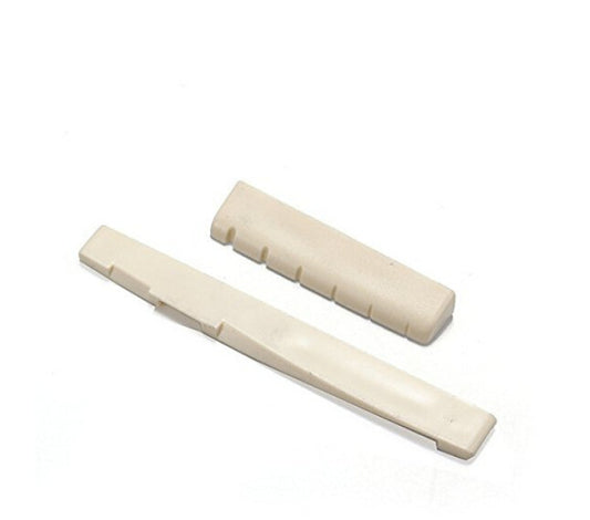 Two beige plastic clips on a white background
