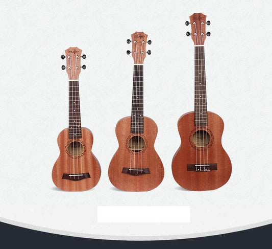 Three ukuleles of different sizes arranged side by side against a white background. They appear to be made of wood with a natural finish.