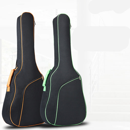 Two acoustic guitar bags with shoulder straps, one orange and one green accented with a solid black body.