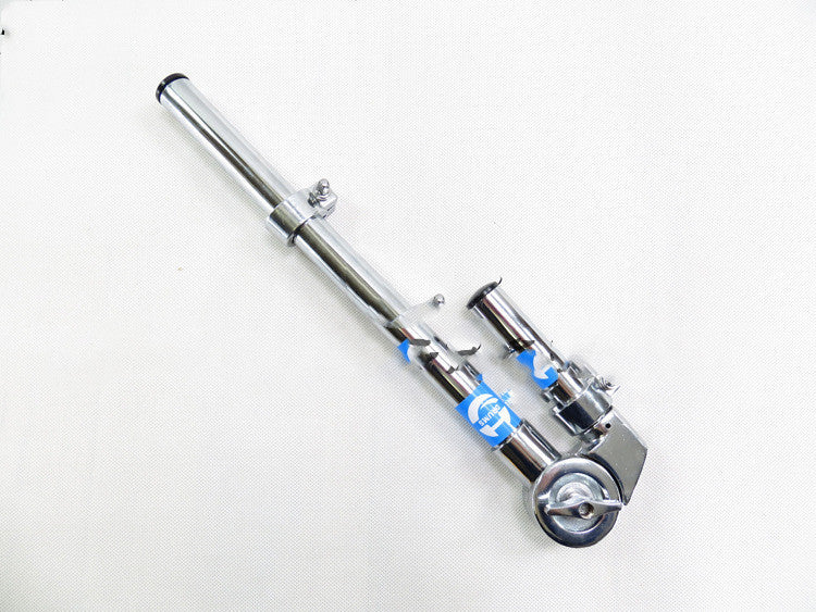 A single arm tom clamp drum stand part of a drum set, with a silver finish and adjustable collar.
