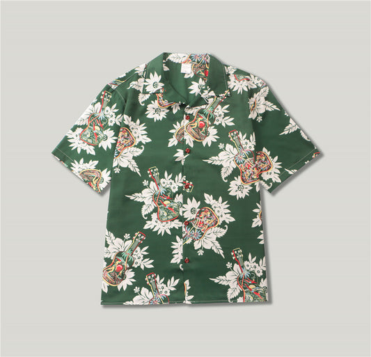 A short-sleeved green shirt with a floral and guitar pattern.
