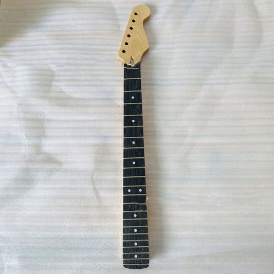 The image shows the neck of an electric guitar with black dots on the fingerboard, a maple wood headstock, and no visible strings.