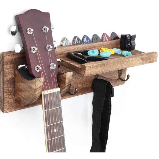 Wall hanging wooden guitar storage rack with multiple compartments, holding a few guitars and their accessories.