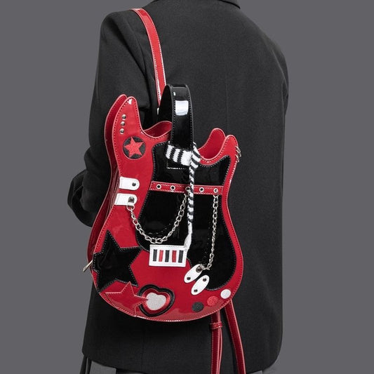 A person wearing a red and black backpack designed to resemble a guitar, with decorative elements such as stars and stripes.
