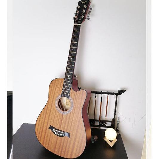 A 38-inch acoustic guitar in a natural wood color, displayed upright with a wall in the background.