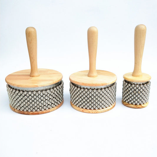 Three wooden bongos in descending size with their respective handles positioned to the left, displayed against a white background.
