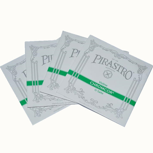 A set of Pirastro violin strings with green and white packaging, indicating chrome steel core strings for violin.