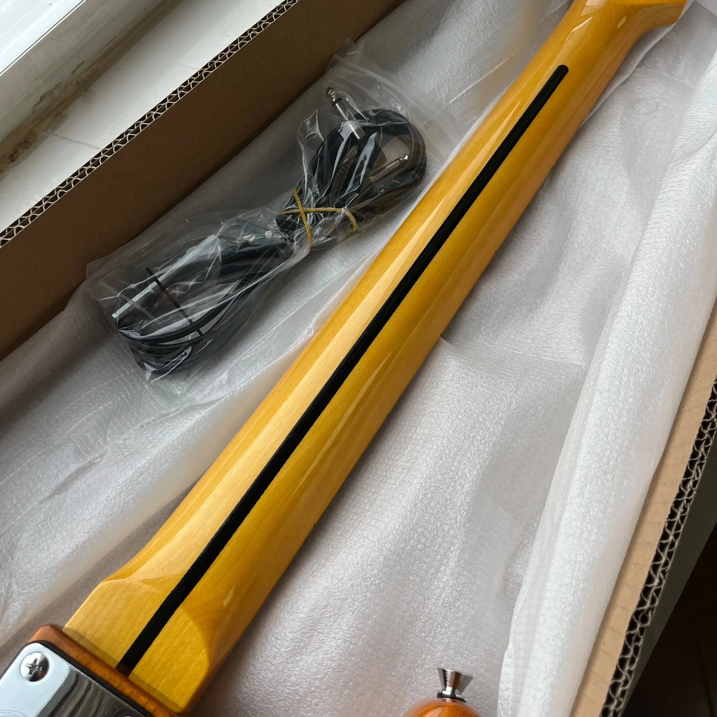 Customized wooden-colored electric guitar with maple fretboard. Durable material, beautiful sound. Free shipping.