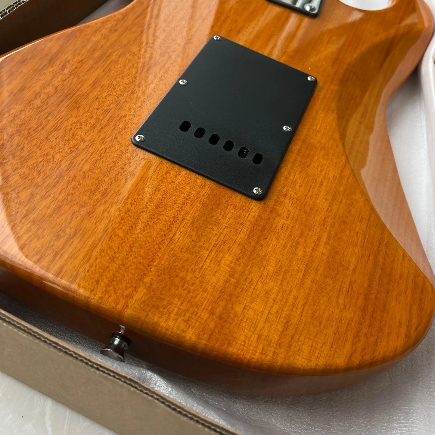 Customized wooden-colored electric guitar with maple fretboard. Durable material, beautiful sound. Free shipping.
