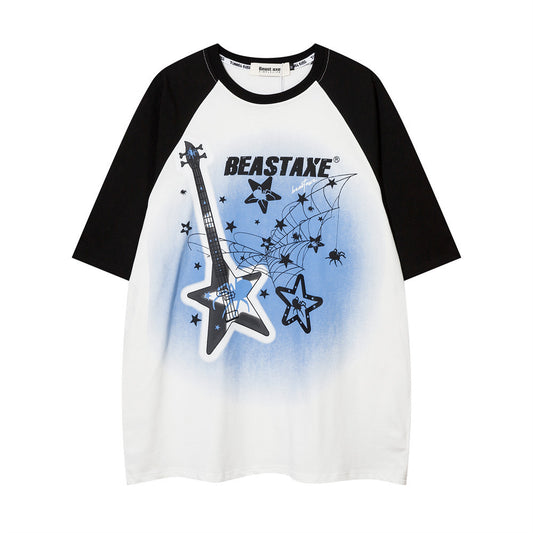 A short sleeve graphic t-shirt with a geometric pattern featuring stars and a guitar, predominantly white with black and apricot accents.